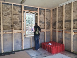 Window is in and Dermot us trying to imagine what it would be like when the kitchen is fitted. Weird red stuff for the underfloor heating is about to go down next.